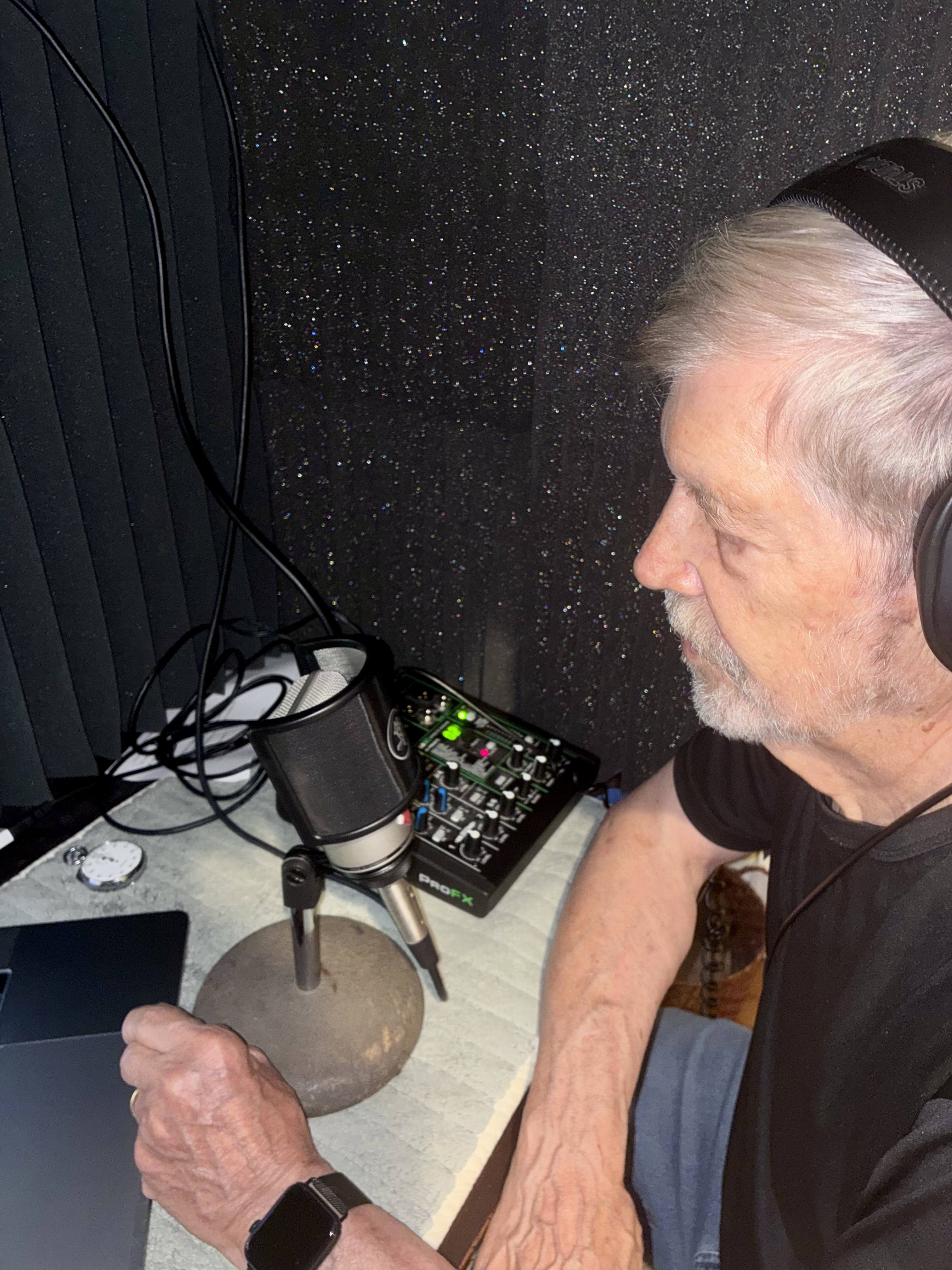 Rich Kleinfeldt at the microphone in his home studio